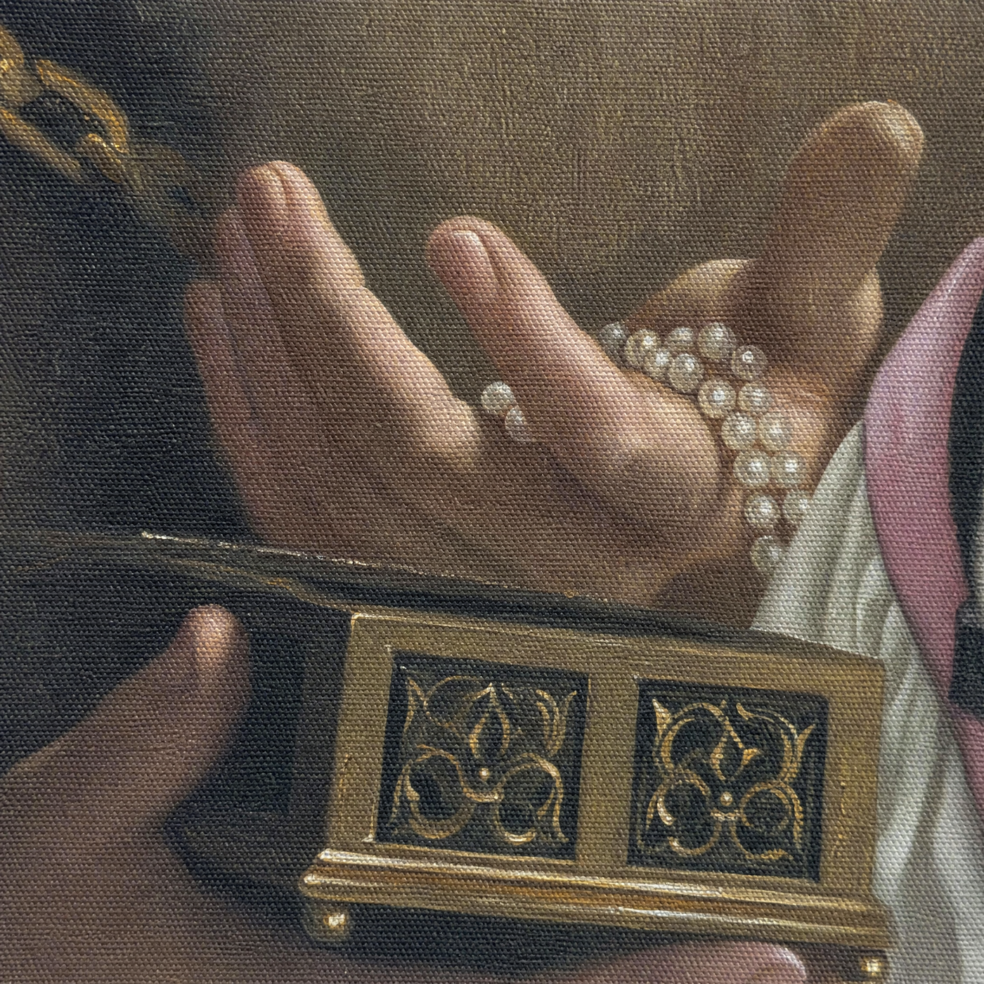 Canvas texture macro of the pearls and gold casket