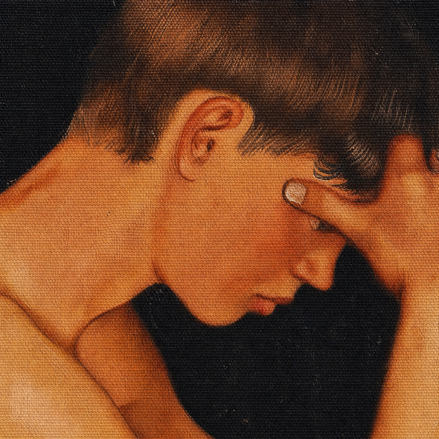 Canvas texture macro of the young man's face